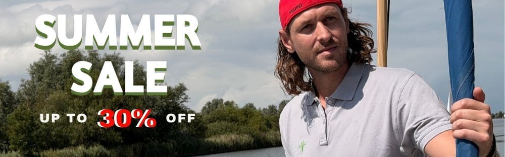 A man wearing a red cap and a light gray Robumi polo shirt stands on a sailboat, with large promotional text reading 'SUMMER SALE' and 'UP TO 30% OFF' over a lake and trees background.